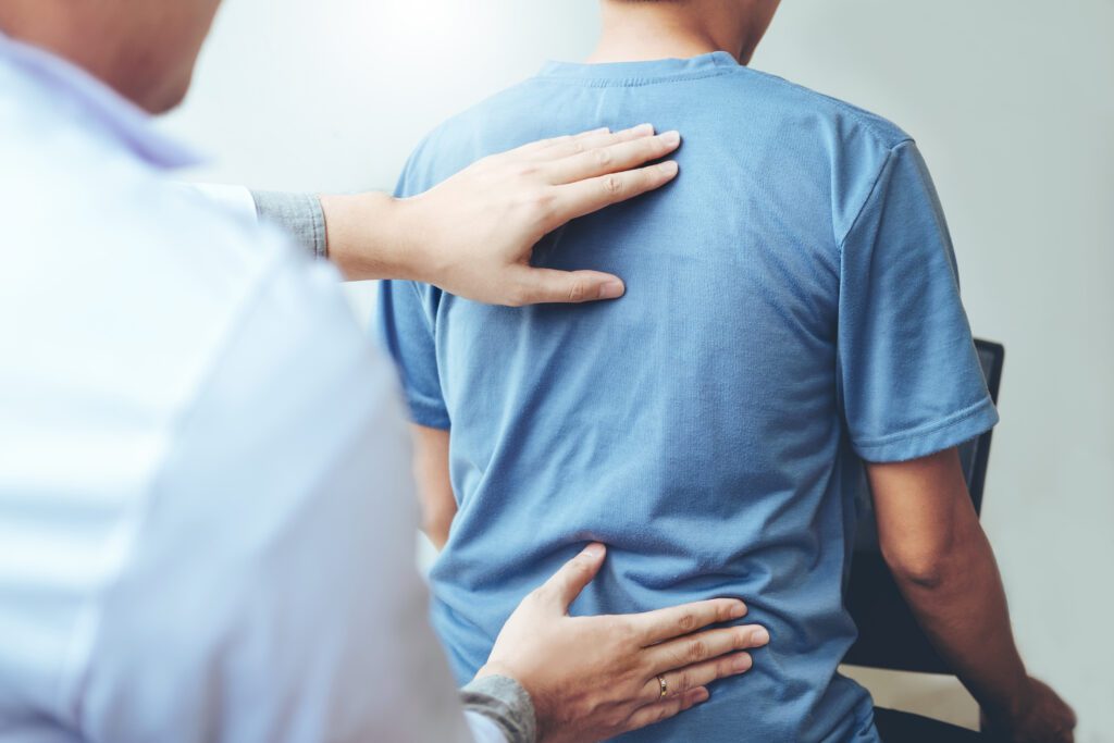 doctor consulting back pain with patient